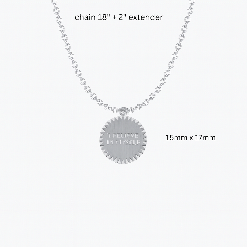 Silver necklace with a round pendant that says "I Believe In Myself" with dimensions on a white background